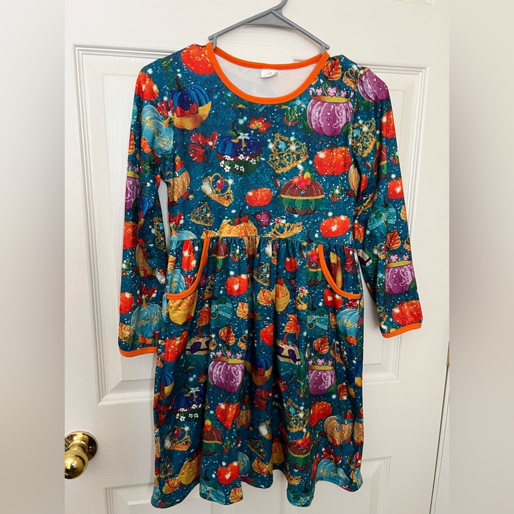 Unique girls dress! Soft and warm, beautiful colors and has pockets